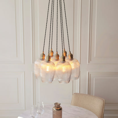 Gallery Direct Polaris 7 Ribbed Cluster Pend Light Antique Brass, styled in a room setting