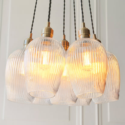 Gallery Direct Polaris 7 Ribbed Cluster Pend Light Antique Brass, close-up of the finish and design