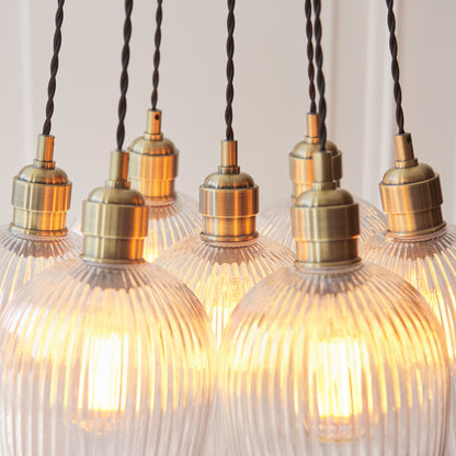 Gallery Direct Polaris 7 Ribbed Cluster Pend Light Antique Brass, close-up of the finish and design