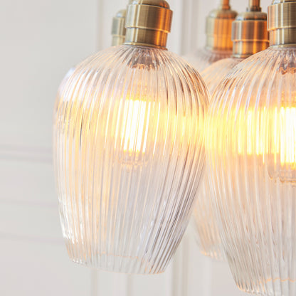 Gallery Direct Polaris 7 Ribbed Cluster Pend Light Antique Brass, close-up of the finish and design