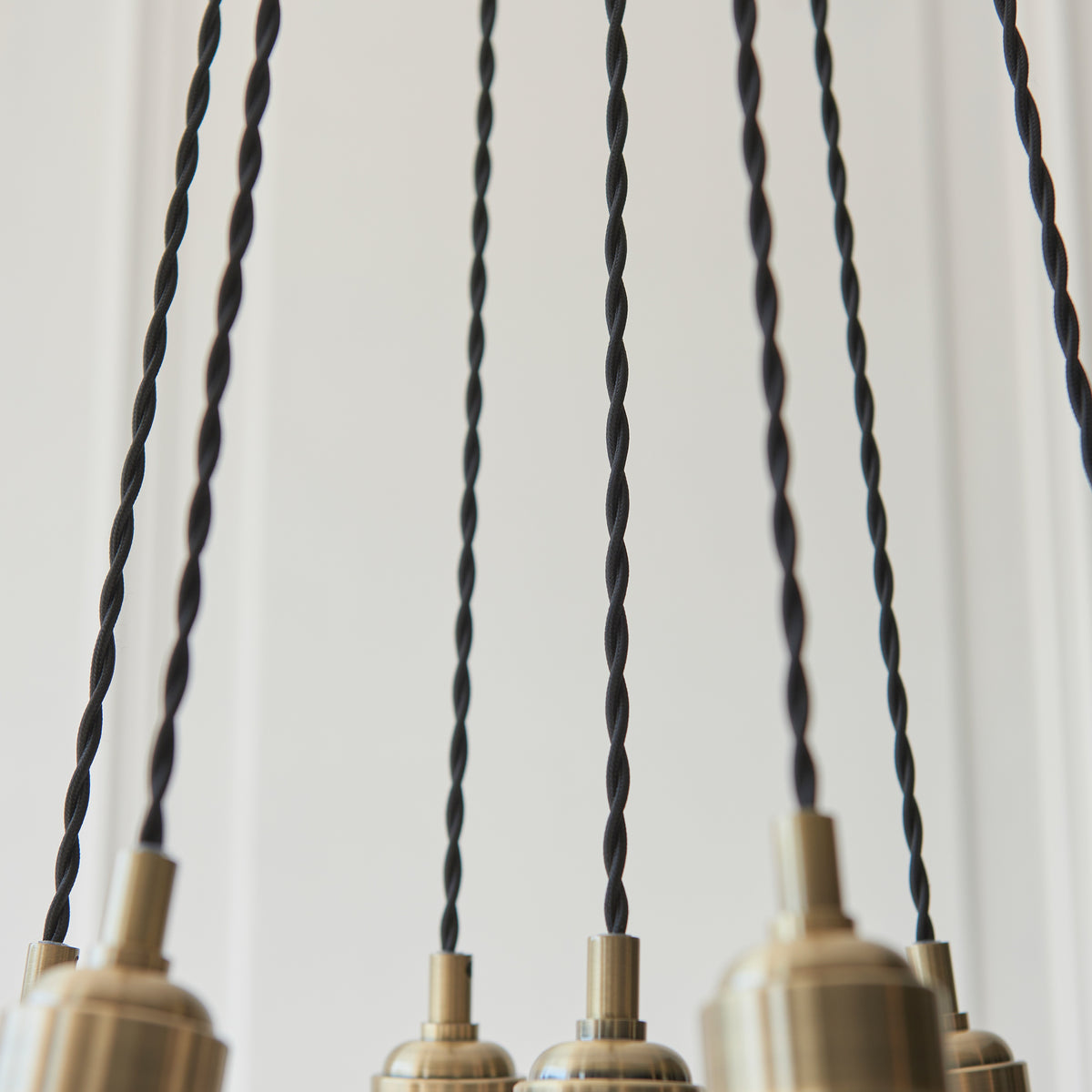 Gallery Direct Polaris 7 Ribbed Cluster Pend Light Antique Brass, close-up of the finish and design
