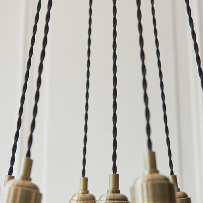 Gallery Direct Polaris 7 Ribbed Cluster Pend Light Antique Brass, close-up of the finish and design