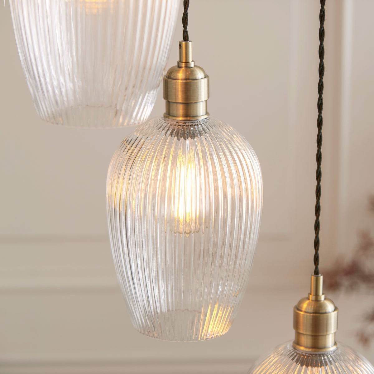 Gallery Direct Polaris 7 Ribbed Pendant Light Antique Brass, close-up of the finish and design