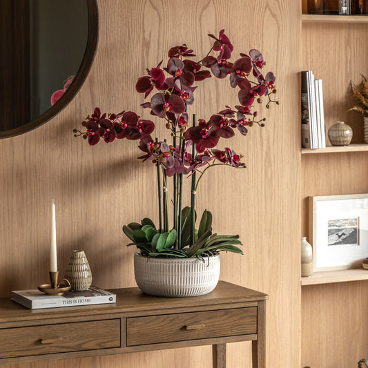 Gallery Direct Real Touch Plum Orchid In Ceramic Ridged Pot, styled in a supplier lifestyle setting