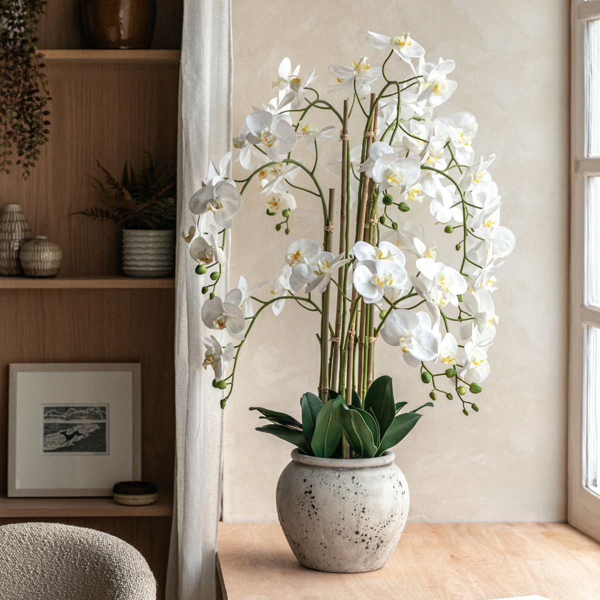 Gallery Direct Real Touch White Orchid In Cement Style Pot, styled in a supplier lifestyle setting