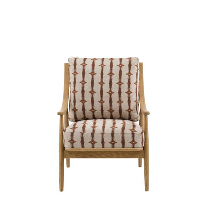 Gallery Direct Reliant Armchair crafted from solid ash wood with a spindle backrest, features generously padded cushions in Indra Stripe patterned fabric