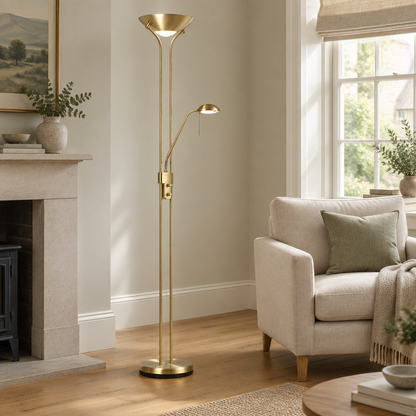 Gallery Direct Rome Floor Lamp Satin Brass styled beside a linen armchair