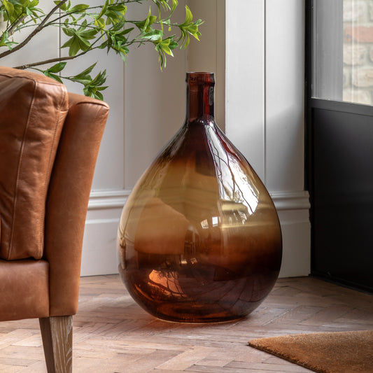 Gallery Direct Rueda Giant Glass Bottle Vase Amber, styled in a supplier lifestyle setting