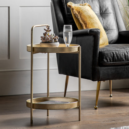Gallery Direct Sennen Side Table in Gold, features a tray like table top and a lower shelf, with handle detail in a luxurious gold leaf finish