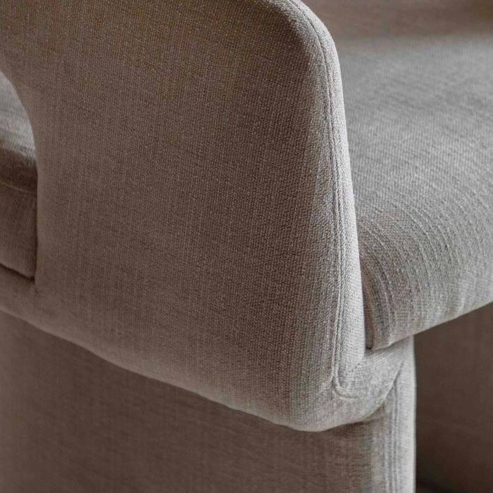 Gallery Direct Sloane Dining Chair is fully upholstered in a Natural toned fabric with padded seat and modern curved frame