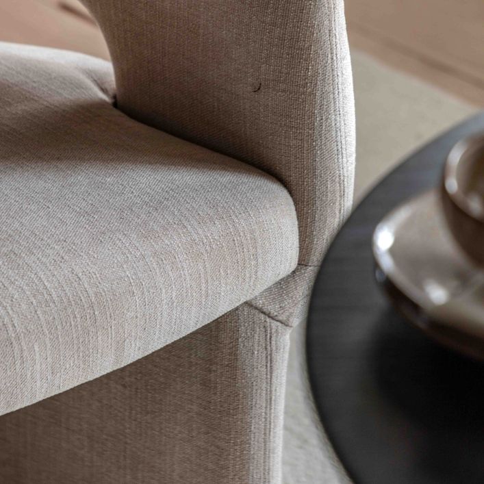 The Gallery Direct Sloane Dining Chair is a fully upholstery modern curved chair, in a Natural tone fabric