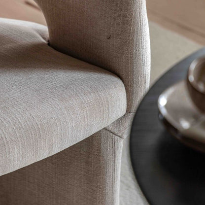 The Gallery Direct Sloane Dining Chair is a fully upholstery modern curved chair, in a Natural tone fabric