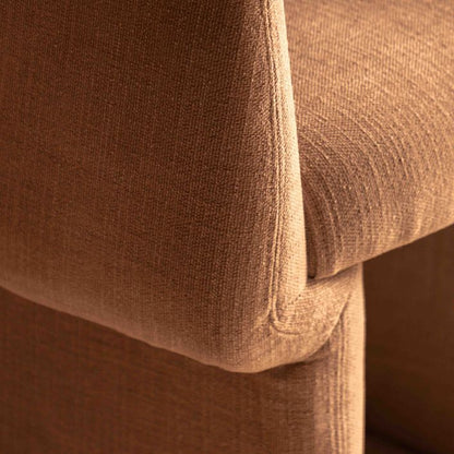 Gallery Direct Sloane Dining Chair is upholstered in a warm Rust toned fabric with comfortable padded seat cushion