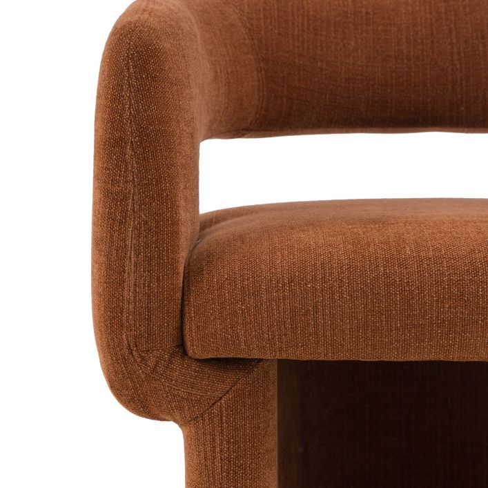 Gallery Direct Sloane Dining Chair is upholstered in a warm Rust toned fabric, with a curved backrest and padded seat for a modern, comfortable dining chair