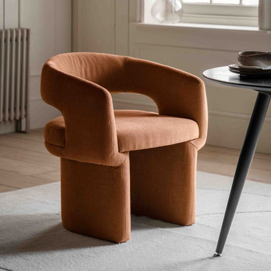 The Gallery Direct Sloane Dining Chair is fully upholstered in a warm Rust coloured fabric, with a modern curved design for a comfortable yet contemporary home