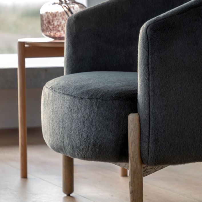 Gallery Direct Tindon Armchair in Alaska Graphite soft plush fabric with a contrasting light wooden frame and legs