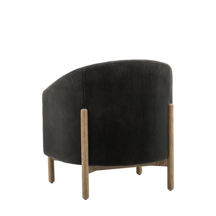 Gallery Direct Tindon Armchair in Alaska Graphite faux fur material with a solid wood base and legs