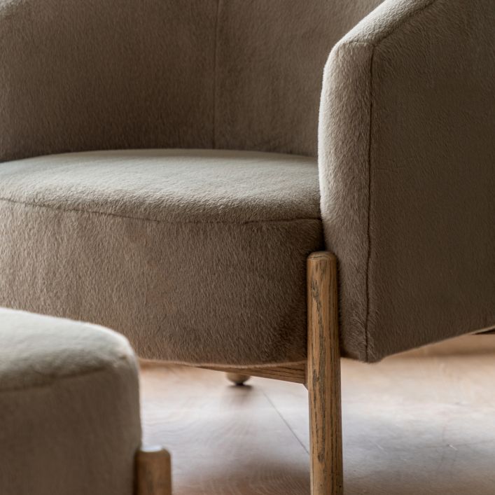 The Gallery Direct Tindon Armchair is upholstered in a soft plush Alaska Khaki colour material with solid wooden base and legs