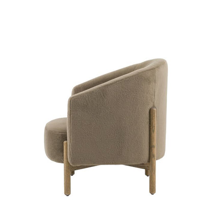 Gallery Direct Tindon Armchair in Alaska Khaki is a curved comfortable chair with a soft plush fabric and solid wood legs