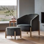The Tindon footstool from Gallery Direct is a soft plush, faux fur upholstered cushion in Alaska Graphite grey colour with a light wood base