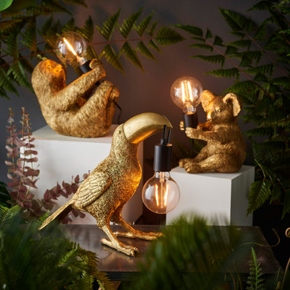 Gallery Direct Toucan Table Lamp Gold, styled in a room setting