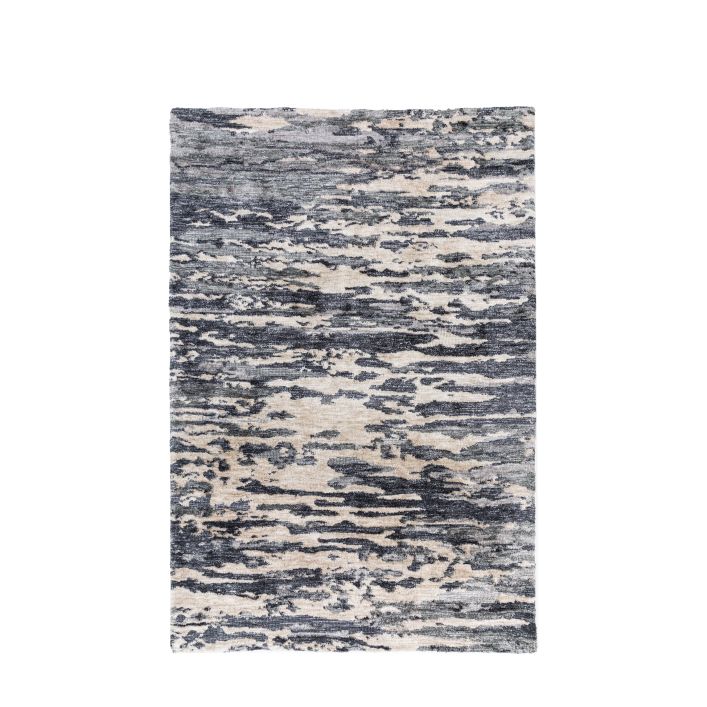 Gallery Direct Trisul Rug measures 1200x1800mm and has striking blue and ink tones in a circular knotted polyester material