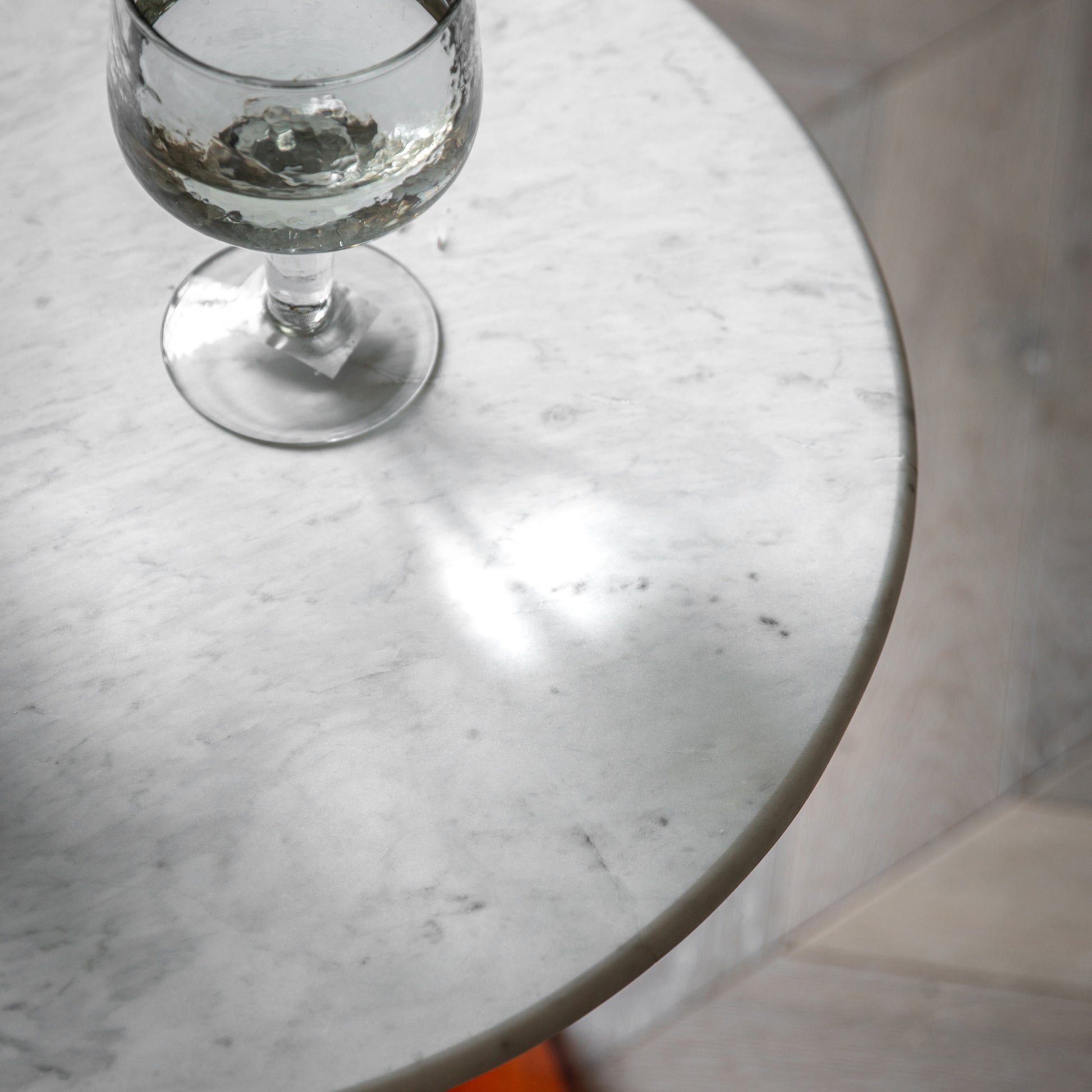 Gallery Direct Turin Side Table in Orange with a round white marble table top