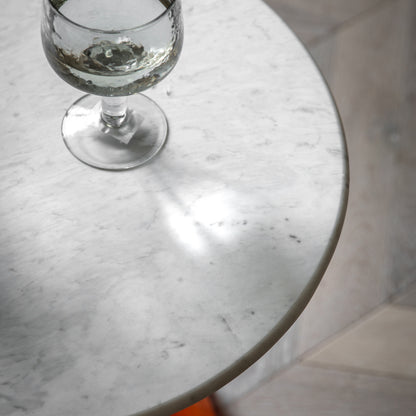 Gallery Direct Turin Side Table in Orange with a round white marble table top