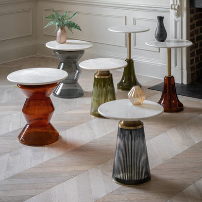 Gallery Direct Turin Side Table features a round white marble top with a sculptural glass base in Orange