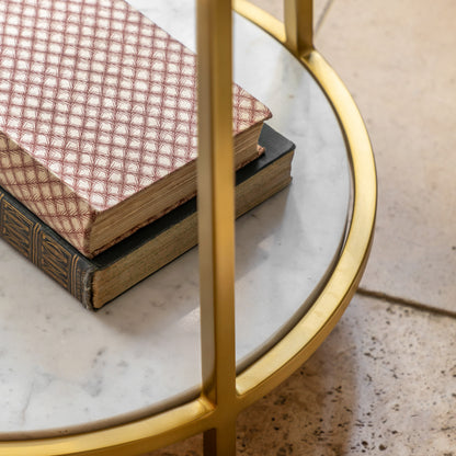 Close-up of the lower marble shelf and brass frame on the Gallery Direct Weston Side Table