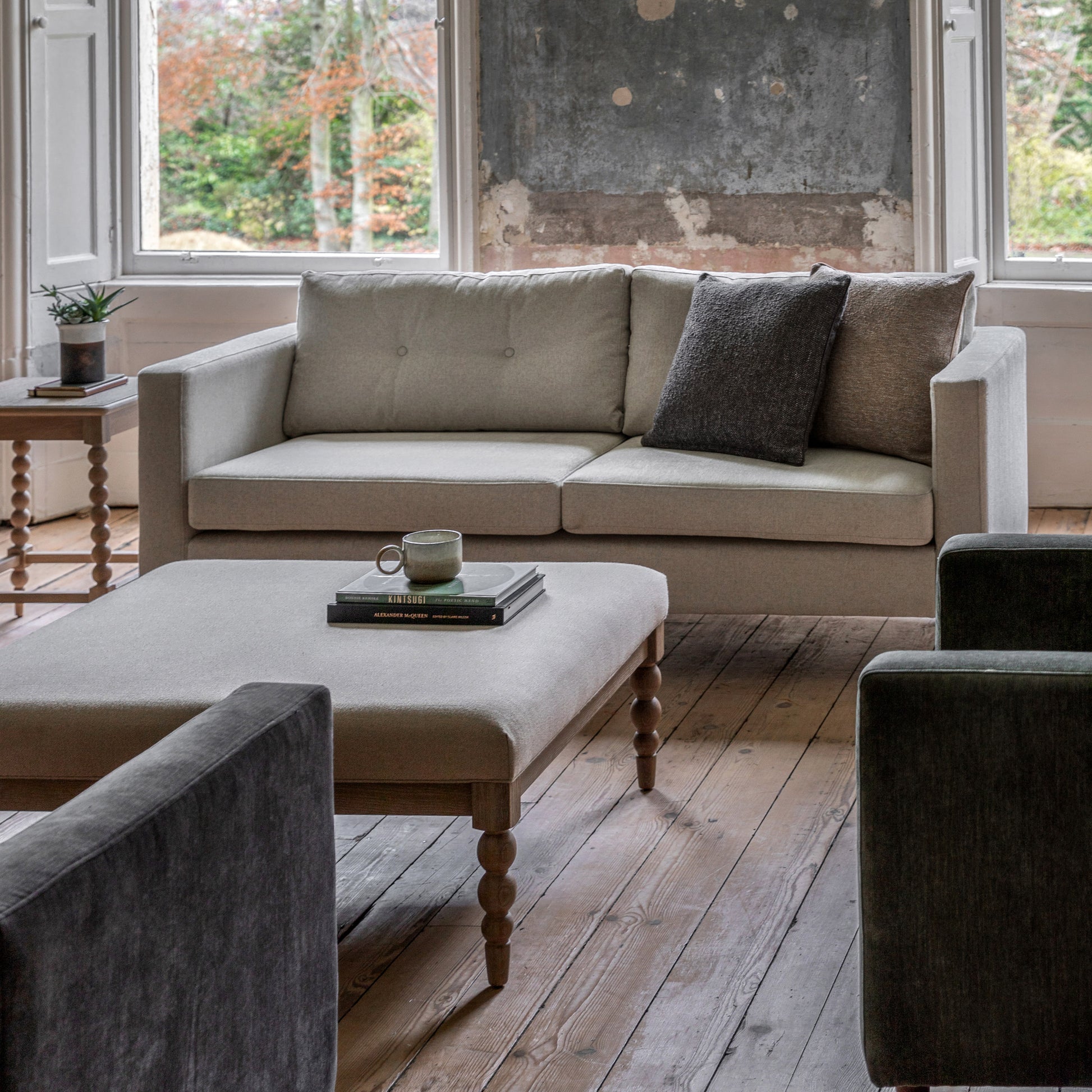 Gallery Direct Whitwell Light Grey 3 Seater Sofa features a distinctive clean lined silhouette with block armrests and button tufted back cushions 