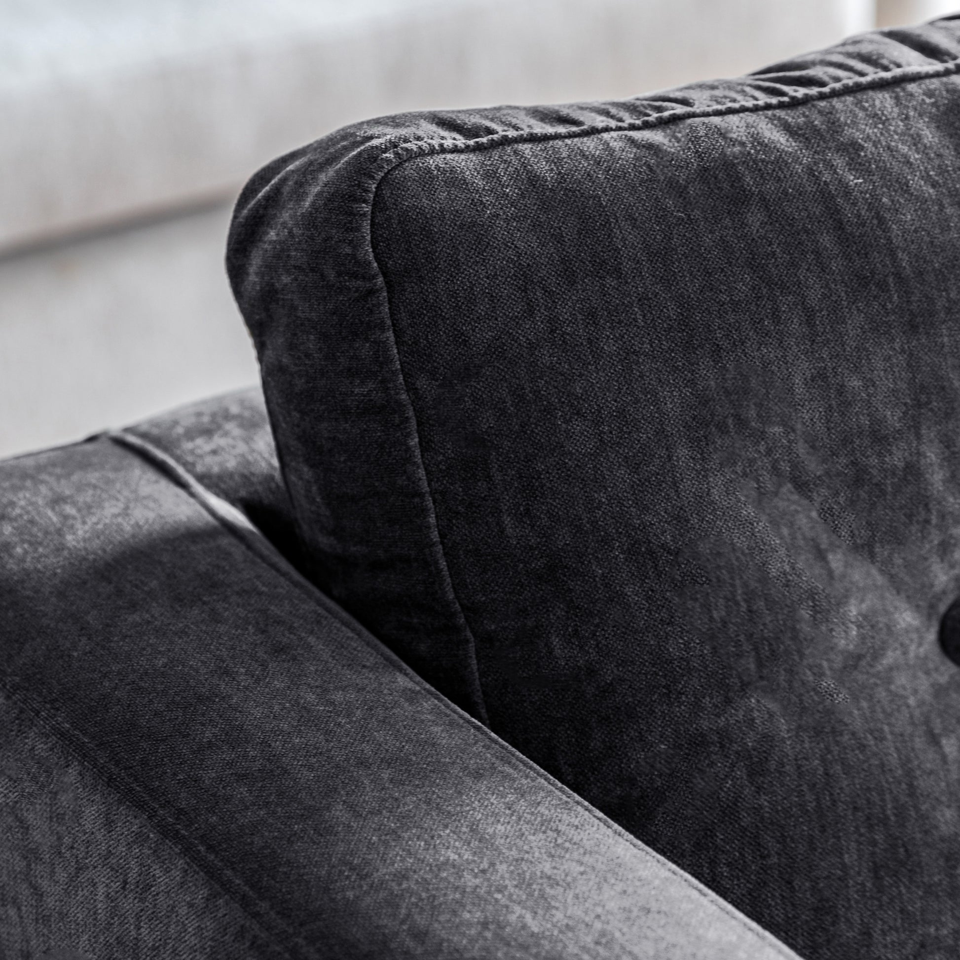 Gallery Direct Whitwell Armchair in Charcoal upholstery with a button tufted back cushion