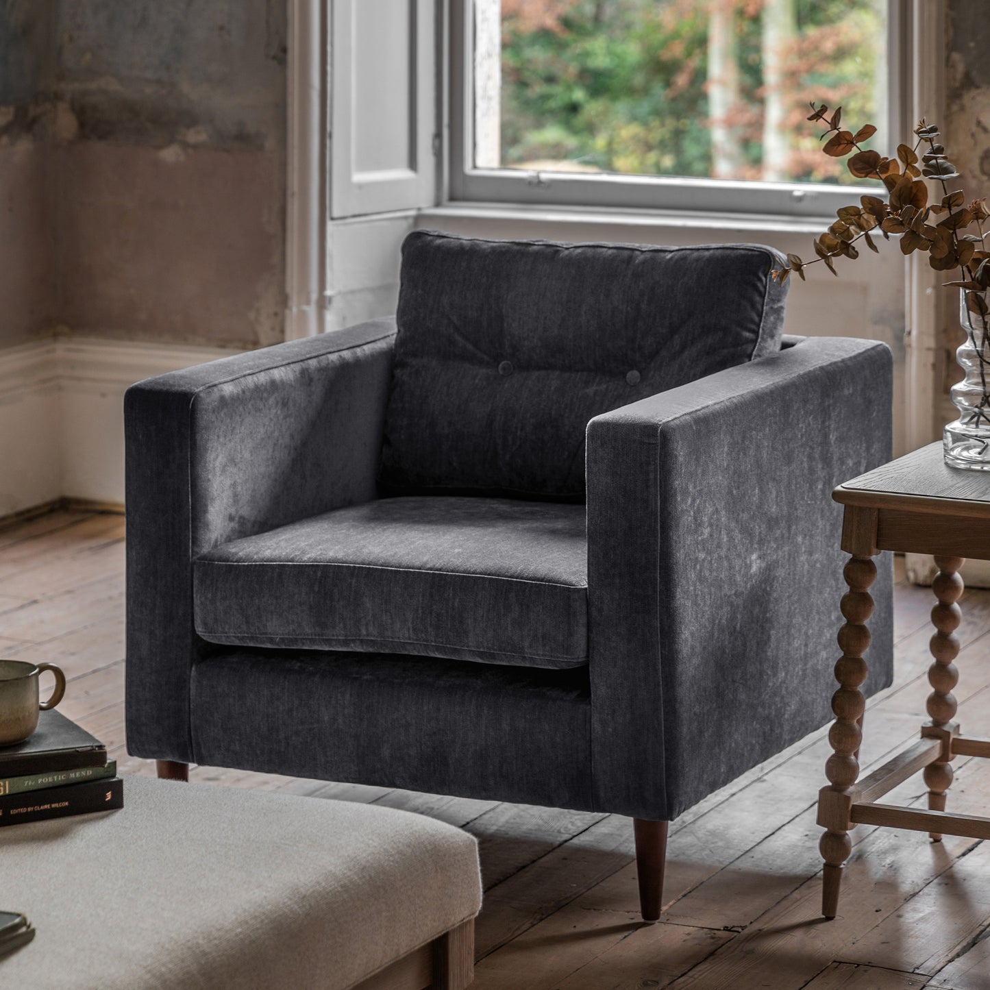Gallery Direct Whitwell Armchair Upholstered in a Charcoal fabric with distinctive block frame and button tufted cushion and tapered wooden legs