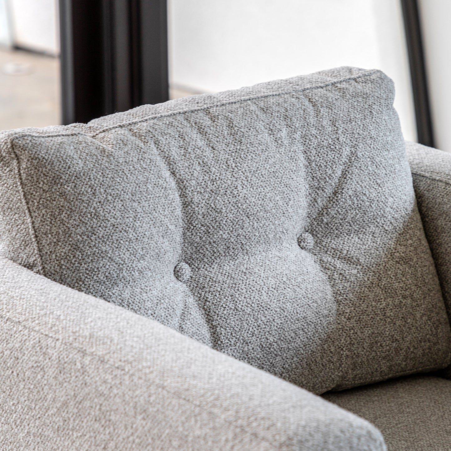 Gallery Direct Whitwell Armchair upholstered in a Light Grey fabric with button tufted back cushion