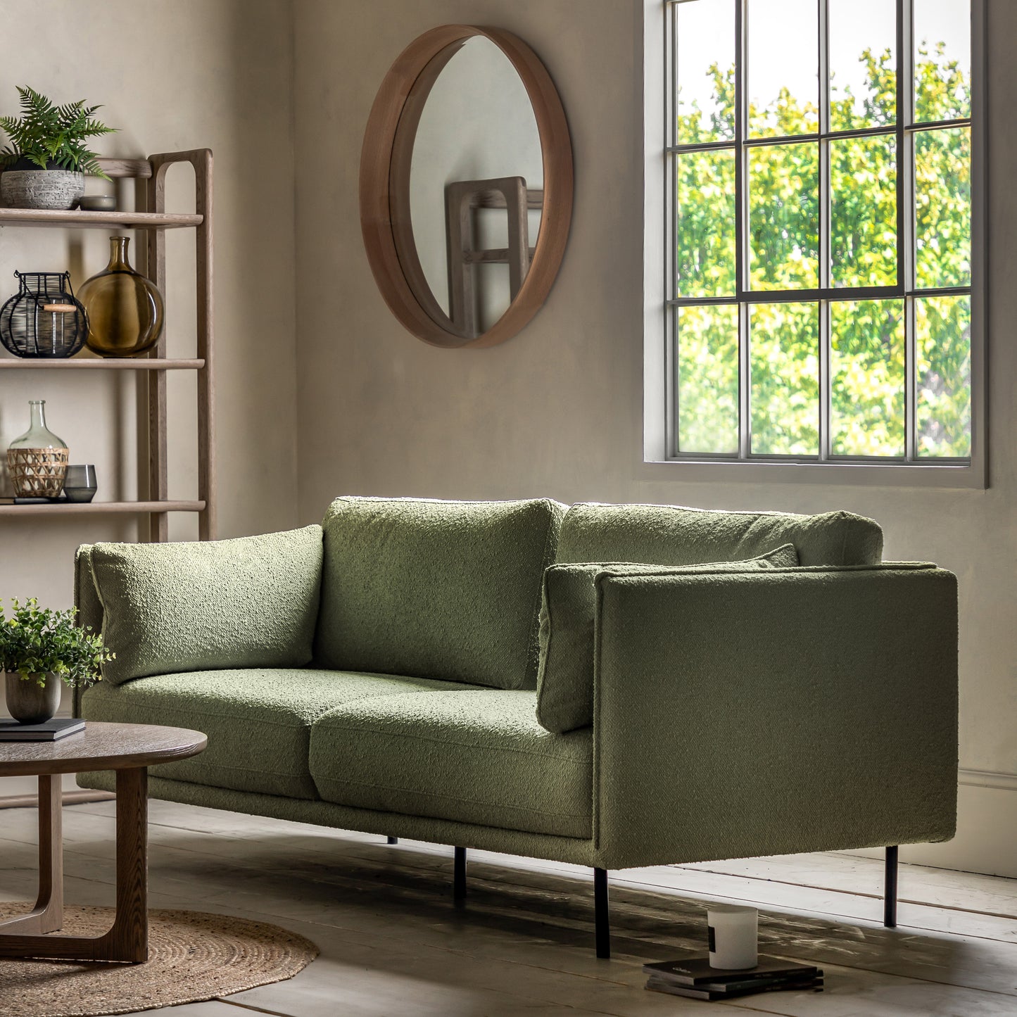 Gallery Direct Wigmore 3 Seater Sofa upholstered in a Green boucle style fabric with side cushions and sleek black metal legs 