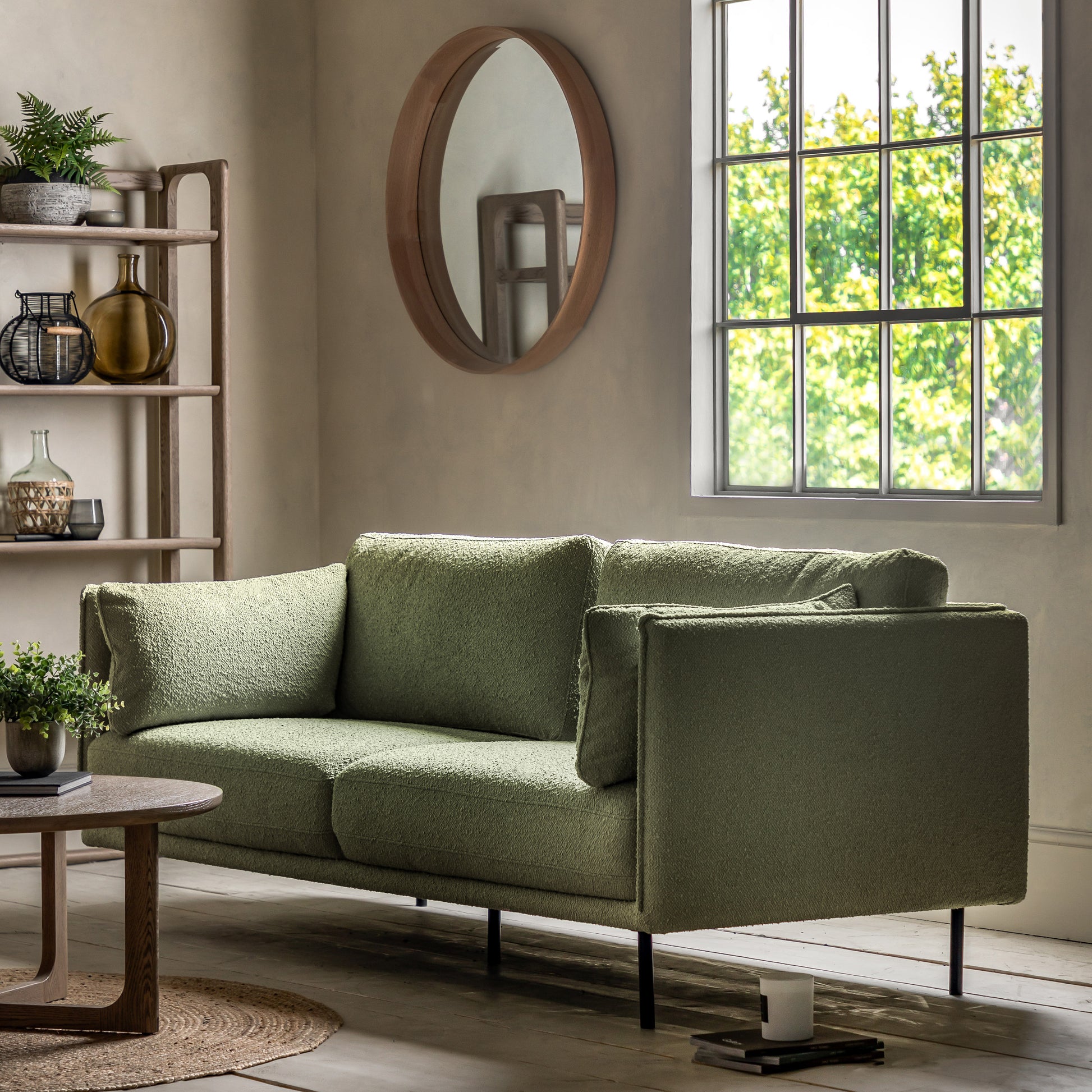 Gallery Direct Wigmore 3 Seater Sofa upholstered in a Green boucle style fabric with side cushions and sleek black metal legs 