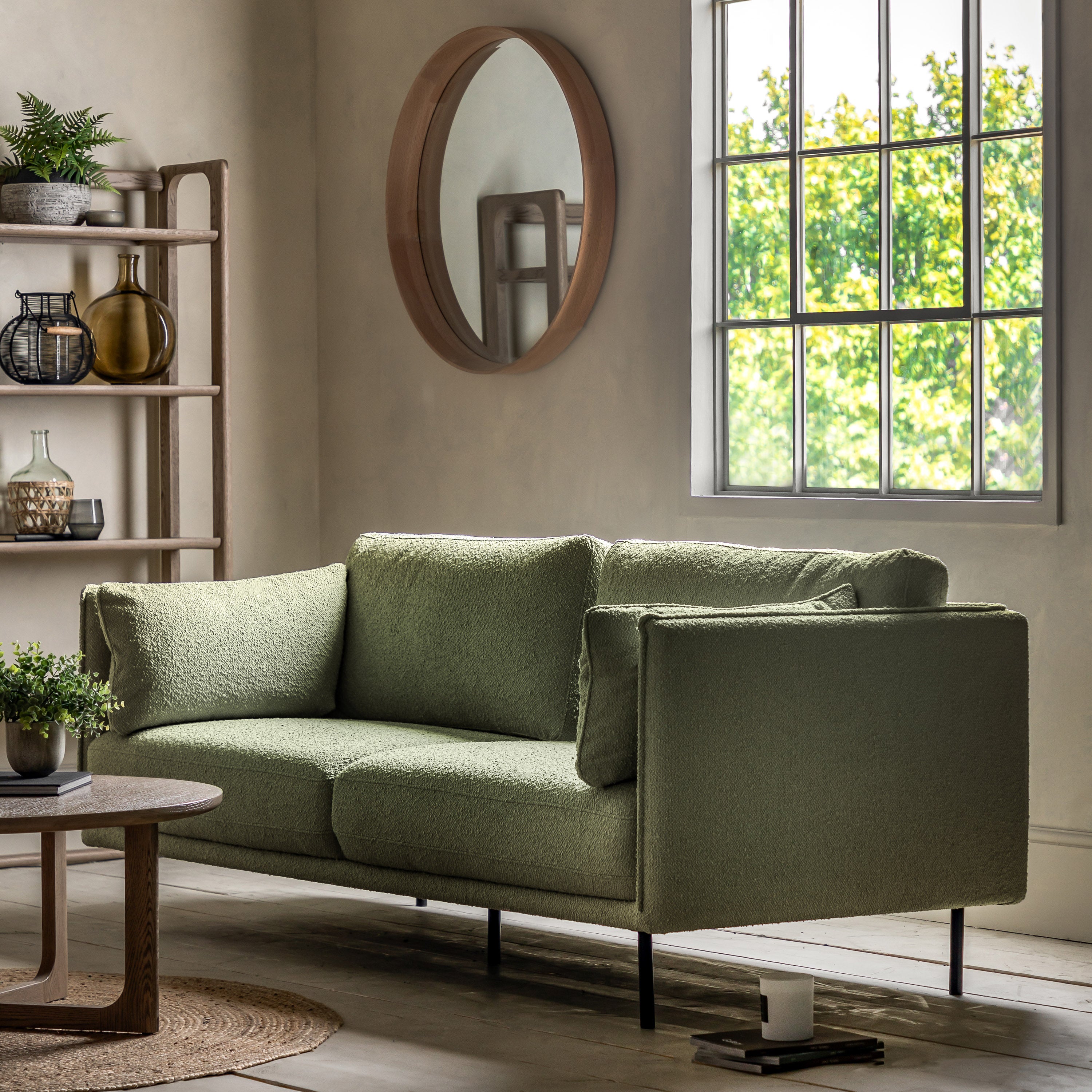 Gallery Direct Wigmore 3 Seater Sofa upholstered in a Green boucle style fabric with side cushions and sleek black metal legs 