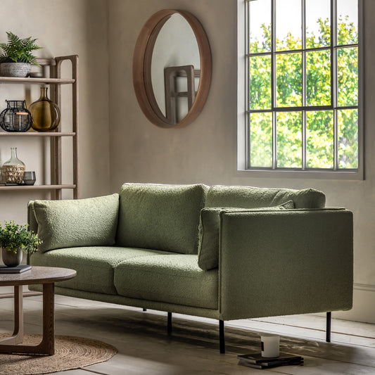 Gallery Direct Wigmore 3 Seater Sofa upholstered in a Green boucle style fabric with side cushions and sleek black metal legs 
