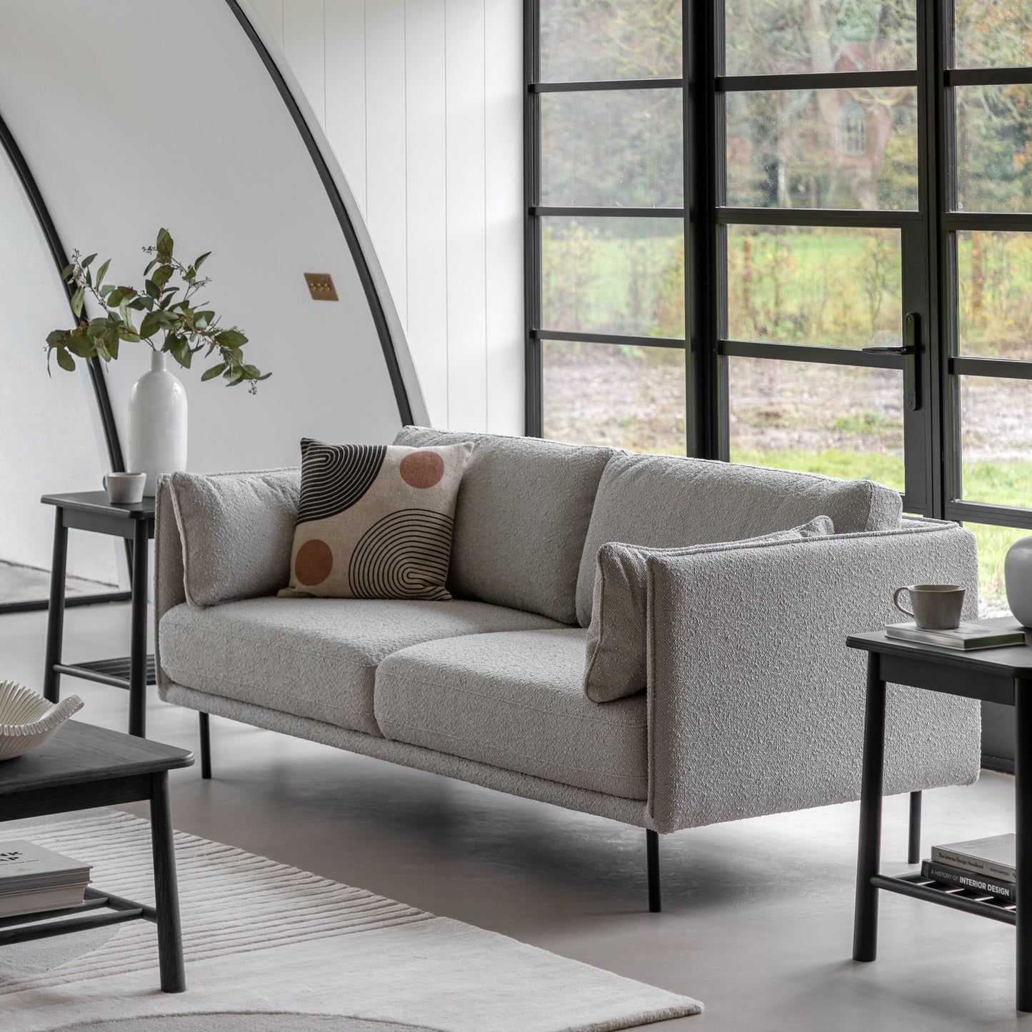 Gallery Direct Wigmore 3 Seater Sofa Upholstered in a Natural coloured boucle fabric with stitched seam detail, slim arms, side cushions and black metal legs 