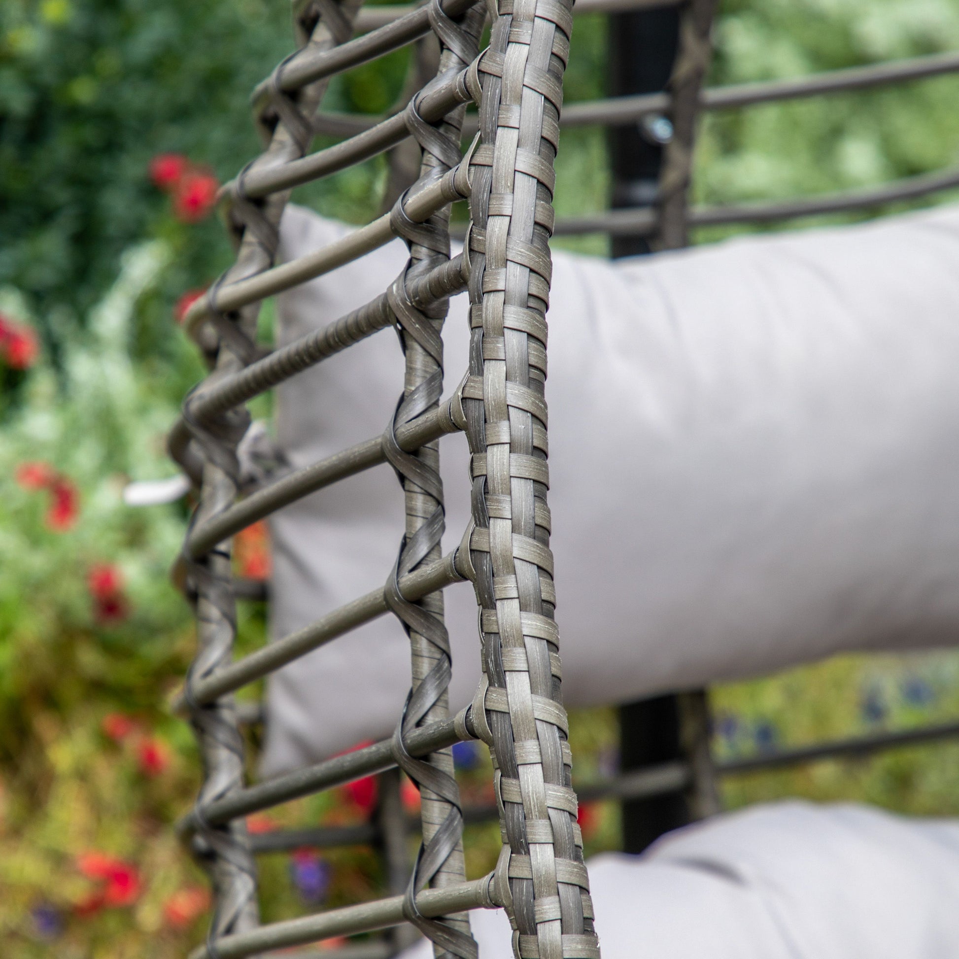 Gallery Garden Adanero Large 2 Seater Hanging Chair with a natural toned open wickerwork basket frame and plush padded cushions
