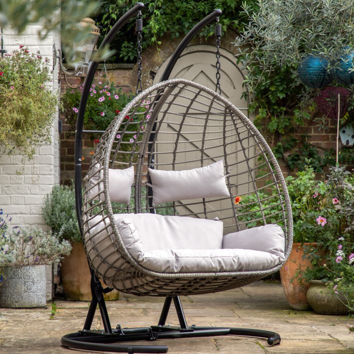 Gallery Garden Adanero Large Hanging Chair can seat up to 2 people and features a rounded open wickerwork frame and padded seat cushions, the chair hangs from a black powder coated sturdy metal stand 