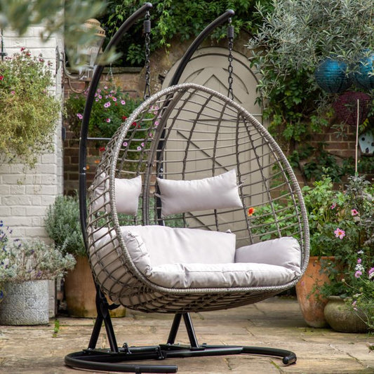 Gallery Garden Adanero Large Hanging Chair can seat up to 2 people and features a rounded open wickerwork frame and padded seat cushions, the chair hangs from a black powder coated sturdy metal stand 
