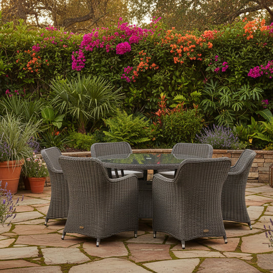 Gallery Garden Ascot 6 Seater Dining Set features a round glass topped table with shelf space underneath, plus 6 wicker chairs complete with natural colour seat cushions