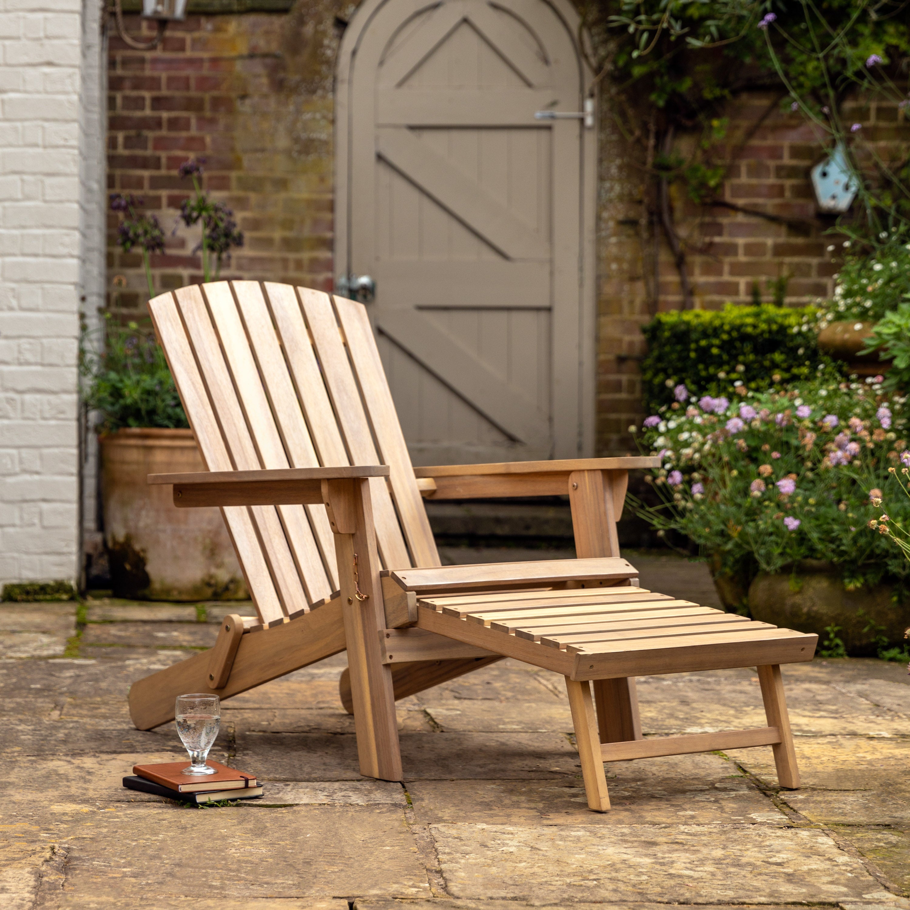 Gallery Garden Aspri Lounge Chair with an extending integrated footstool crafted from acacia wood with slatted seat and backrest