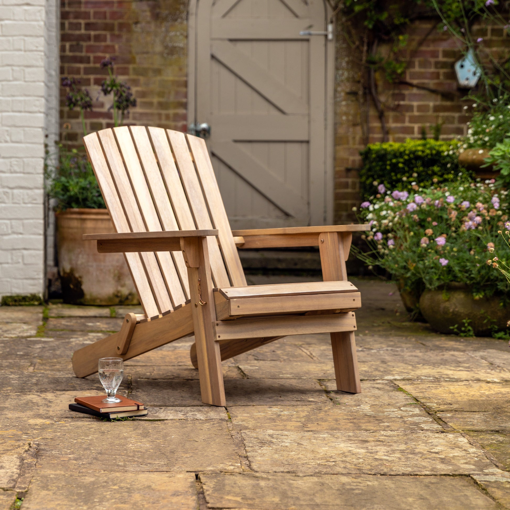 Gallery Garden Aspri Lounge Chair with extending Footstool has a slatted wood backrest and seat and can be folded for easy storage