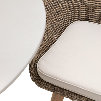 Gallery Garden Avena 4 Seater Dining Set has 4 woven wicker style chairs with a natural coloured seat pad, and a round glass topped table