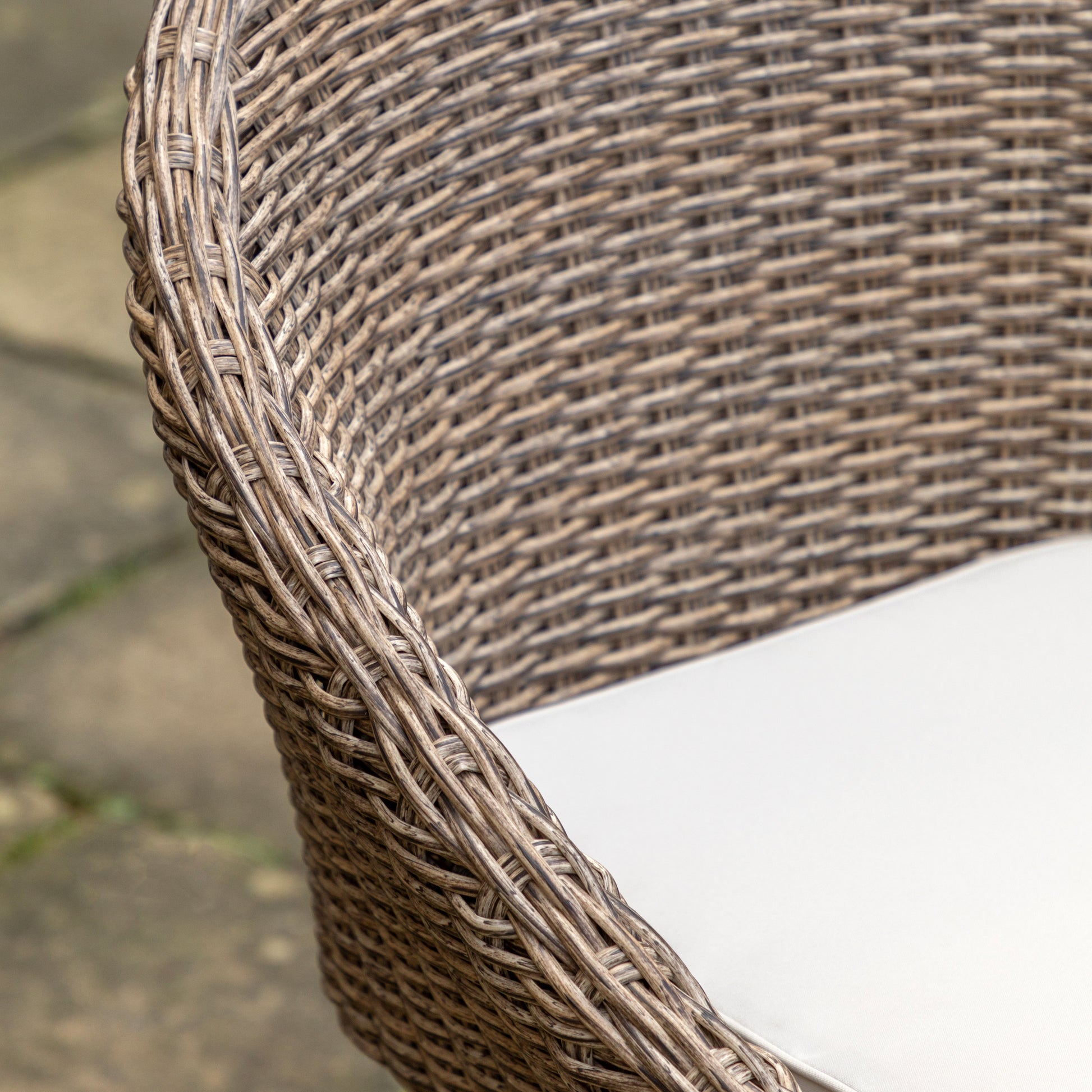 Gallery Garden Avena 4 Seater Round Dining Set includes 4 woven wicker style chairs with curved design and natural colour seat pad 