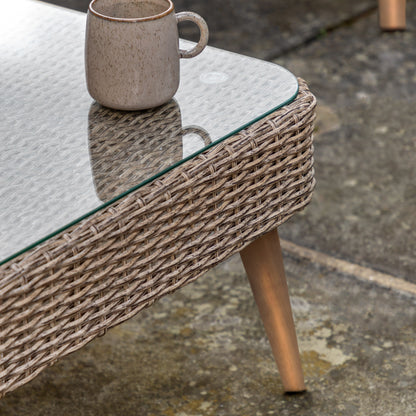 Gallery Garden Avena Corner Lounge Set features a corner sofa and matching coffee table with poly-rattan wicker style frame, a glass table top and oiled acacia wood legs