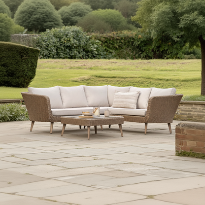 Gallery Garden Avena Corner Lounge Set consists of a corner sofa with seat and backrest cushions plus a glass top coffee table, made from durable woven wicker with stylish wooden legs