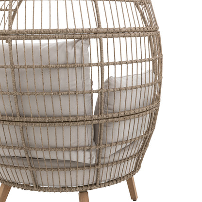 Gallery Garden Avena Egg Chair features an open wickerwork rounded frame with acacia wood legs and natural toned cushions